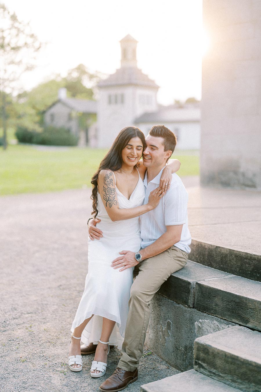 Sumbul and Brian sitting together during their Dundurn Castle engagement photoshoot