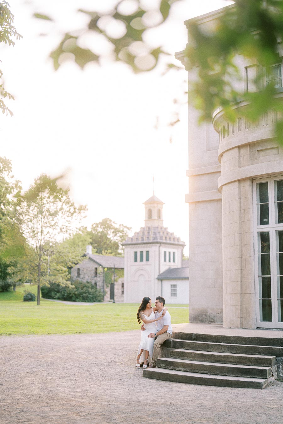 Sumbul and Brian seated on Dundurn Castle steps in Hamilton