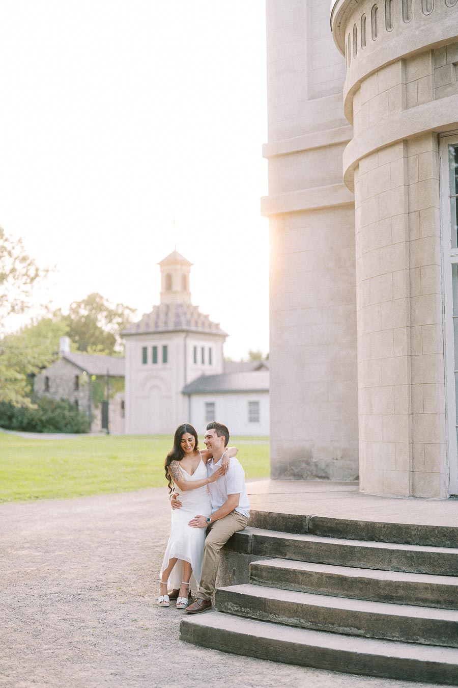 Sumbul and Brian seated on Dundurn Castle steps in Hamilton