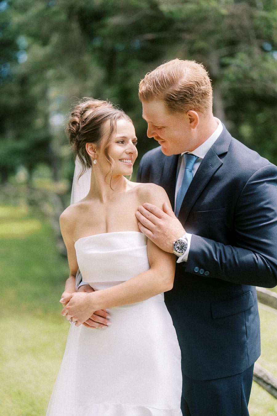 Bride and groom embracing outdoors during a private estate wedding near Chatham-Kent, Ontario, Canada.