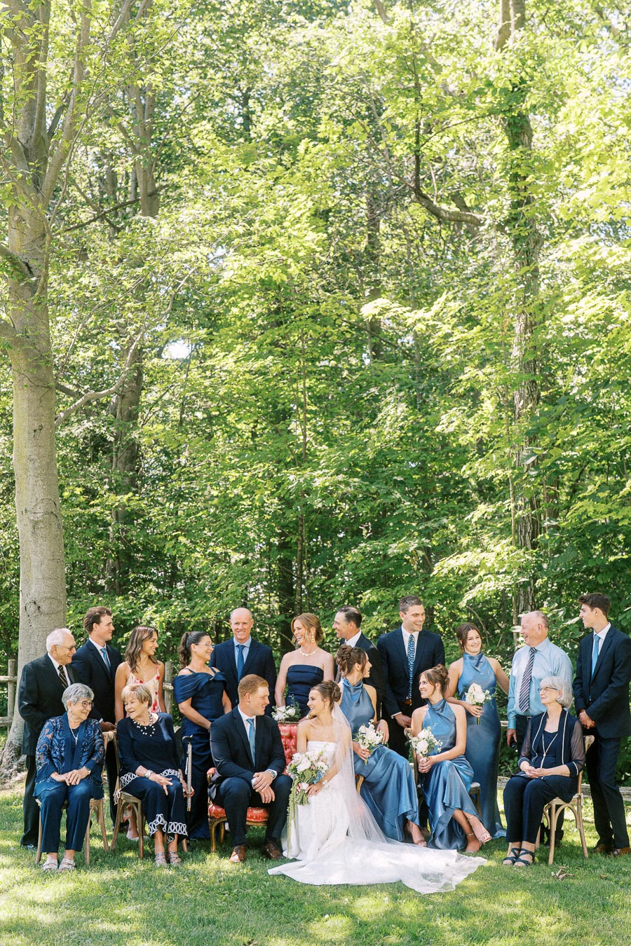 Bride and groom pose with relatives and wedding party outdoors on a private estate near Chatham-Kent, Ontario, Canada.