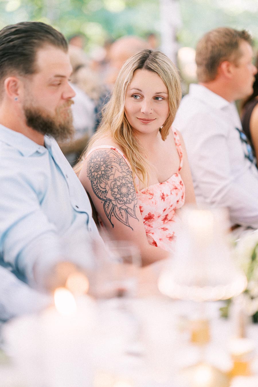 Wedding guests seated at an outdoor tented reception on a private farm estate near Chatham-Kent, Ontario, Canada.