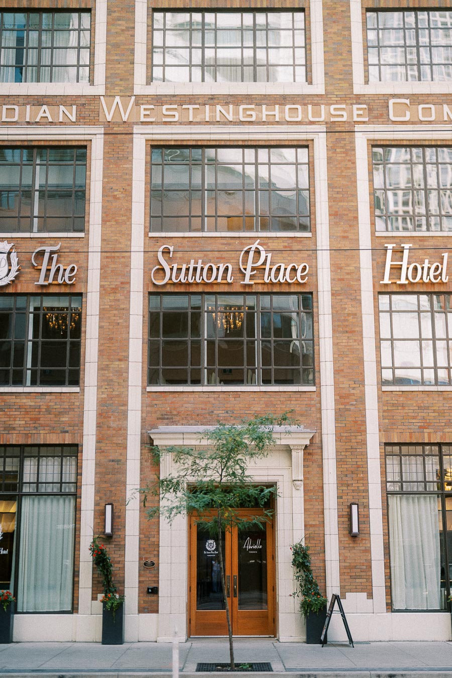 The Sutton Place Hotel entrance on a brick facade in downtown Toronto