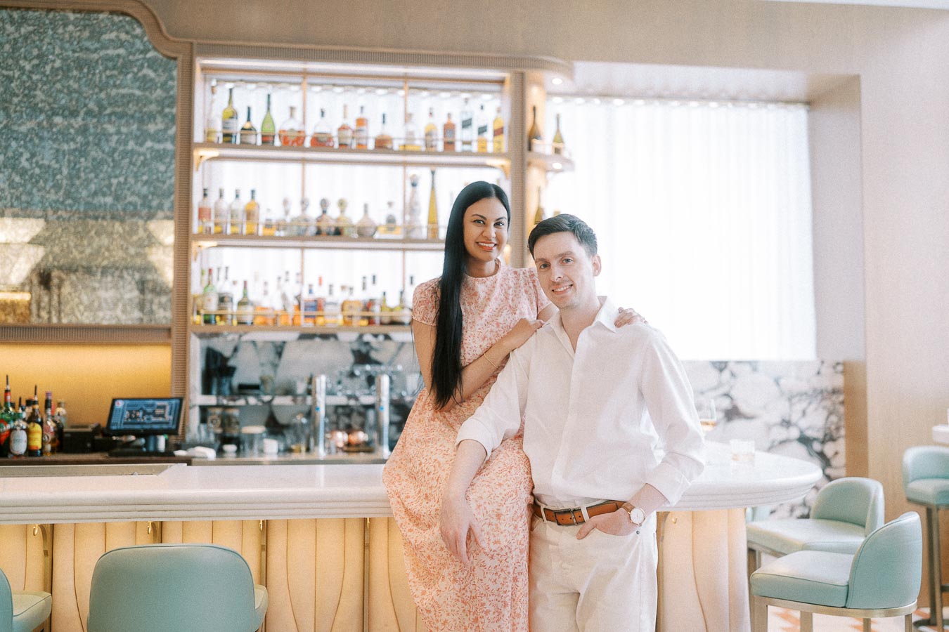 Mike and Becky posing together at a bright bar in Toronto