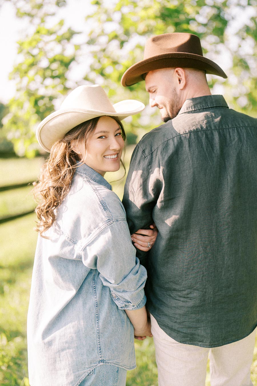 Couple in cowboy hats walking together at The Green Acres in Flamborough