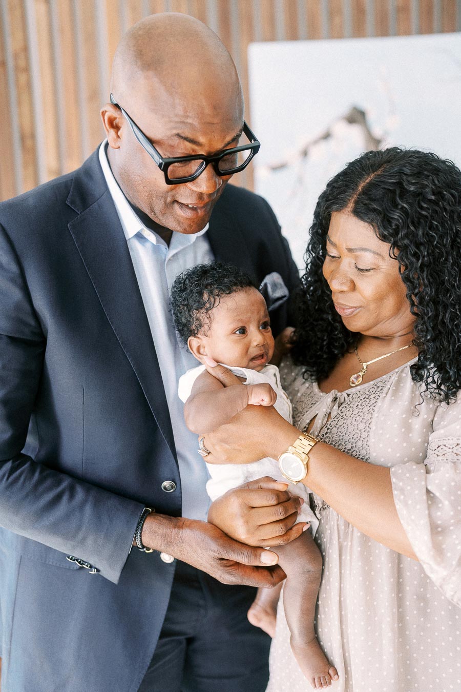 Karina and Terence holding baby Isabella together at their Toronto home.