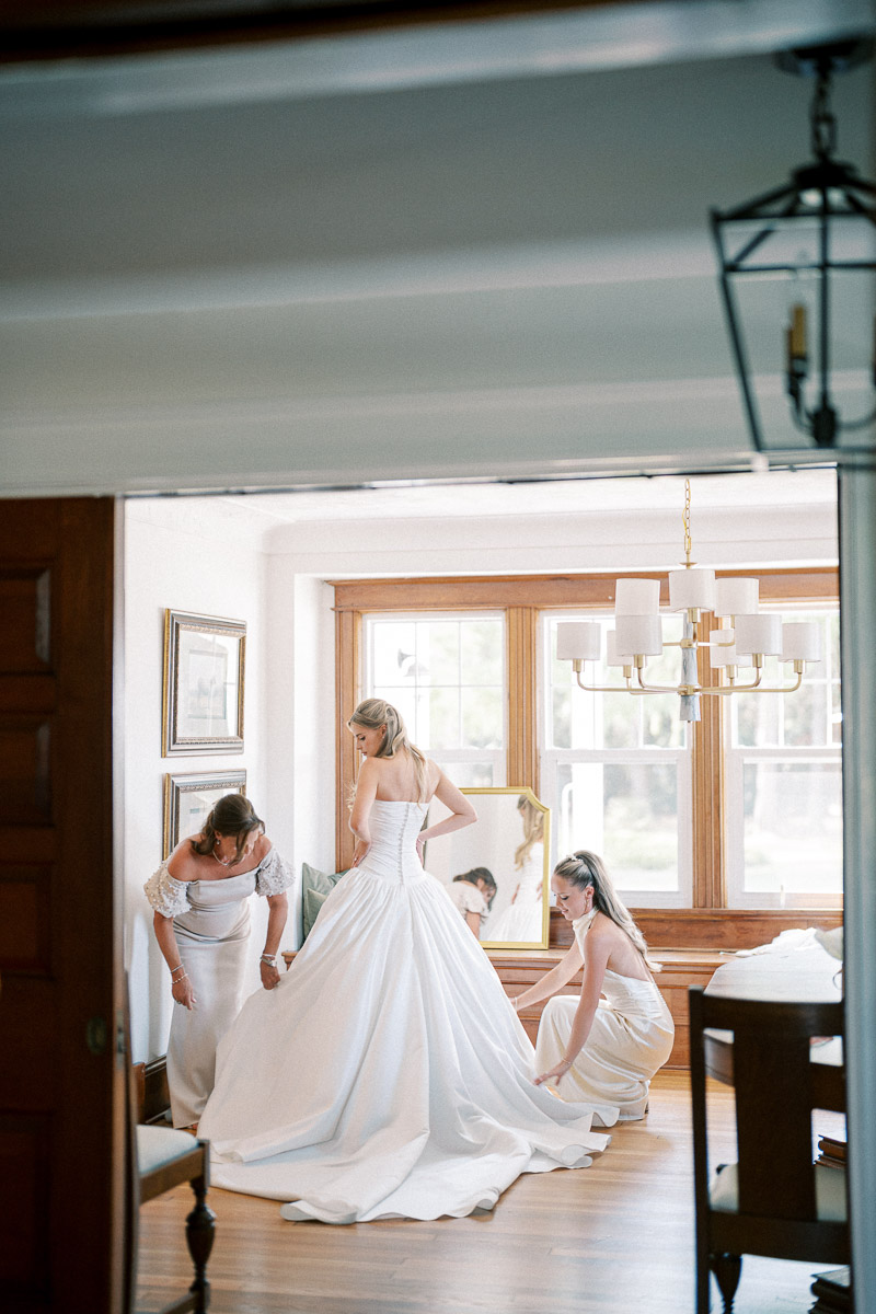 A documentary getting-ready moment as the bride prepares inside the Martin Estates farmhouse in Niagara.